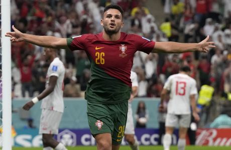 Portugal's Goncalo Ramos celebrates after scoring his side's fifth goal during the World Cup round of 16 soccer match between Portugal and Switzerland, at the Lusail Stadium in Lusail, Qatar, Tuesday, Dec. 6, 2022. (AP Photo/Alessandra Tarantino)