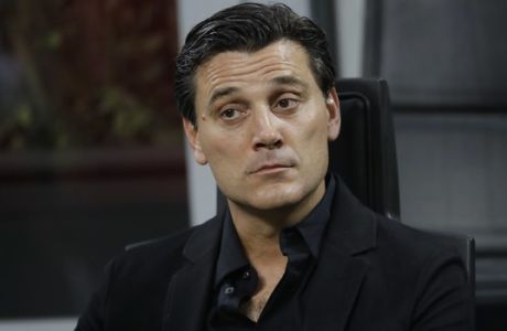 AC Milan coach Vincenzo Montella sits on the bench during a Serie A soccer match between AC Milan and Cagliari, at the San Siro stadium in Milan, Italy, Sunday, Aug. 27, 2017. (AP Photo/Luca Bruno)