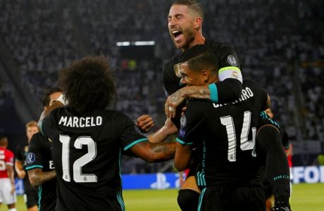 Real Madrid's Sergio Ramos, reacts as he embraces his teamate Casemiro , front right, who score the first goal of their team against Manchester United during the UEFA Super Cup final soccer match between Real Madrid and Manchester United at Philip II Arena in Skopje, Tuesday, Aug. 8, 2017. (AP Photo/Boris Grdanoski)