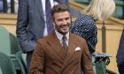 Former England soccer player David Beckham arrives to take his seat in the Royal Box before a men's singles quarterfinal match on day ten of the Wimbledon tennis championships in London, Wednesday, July 6, 2022. (AP Photo/Kirsty Wigglesworth)