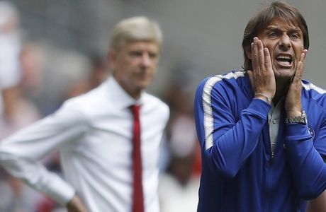Chelsea's team manager Antonio Conte, right, and Arsenal manager Arsene Wenger react during the English Community Shield soccer match between Arsenal and Chelsea at Wembley Stadium in London, Sunday, Aug. 6, 2017. (AP Photo/Frank Augstein)
