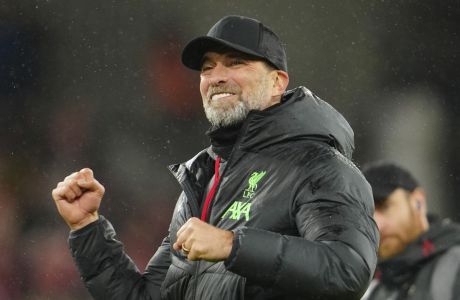 Liverpool's manager Jurgen Klopp celebrates with fans at the end of the English FA Cup fifth round soccer match between Liverpool and Southampton at Anfield stadium, in Liverpool, Wednesday, Feb. 28, 2024. (AP Photo/Jon Super)