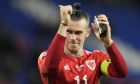 FILE - Wales' Gareth Bale reacts after the UEFA Nations League soccer match between Wales and Poland at the Cardiff City Stadium in Cardiff, Wales, Sunday, Sept. 25, 2022. (AP Photo/Frank Augstein, File)