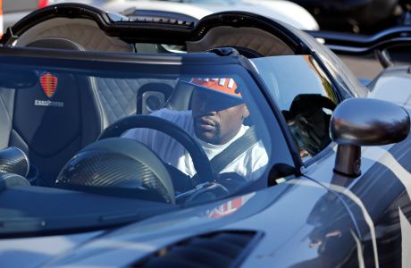 Floyd Mayweather Jr. parks his super car at his gym Wednesday, Aug. 26, 2015, in Las Vegas. Mayweather is scheduled to fight Andre Berto in a welterweight title bout next month in Las Vegas. (AP Photo/John Locher)