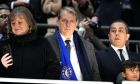 Chelsea's owner Todd Boehly, centre, reacts disappointed while Liverpool team celebrates winning the English League Cup final soccer match between Chelsea and Liverpool at Wembley Stadium in London, Sunday, Feb. 25, 2024. (AP Photo/Dave Shopland)
