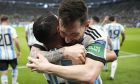 Argentina's Lionel Messi, right, celebrates with his teammate Angel Di Maria after scoring his side's opening goal during the World Cup group C soccer match between Argentina and Mexico, at the Lusail Stadium in Lusail, Qatar, Saturday, Nov. 26, 2022. (AP Photo/Ariel Schalit)