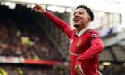Manchester United's Jadon Sancho celebrates after scoring his side's third goal during the English Premier League soccer match between Manchester United and Leicester City at the Stamford Bridge stadium in Manchester, England, Sunday, Feb. 19, 2023. (AP Photo/Dave Thompson)