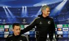 Chelsea's manager Jose Mourinho, right, puts his hand on the shoulder of player John Terry during a press conference at Stamford Bridge stadium in London, Tuesday, April 29, 2014. Chelsea will play in a Champions League semifinal second leg soccer match against Atletico Madrid on Wednesday. (AP Photo/Kirsty Wigglesworth) 