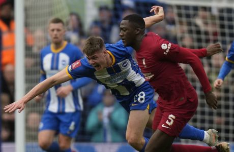 Liverpool's Ibrahima Konate, right, is challenged by Brighton's Evan Ferguson during the FA Cup 4th round soccer match between Brighton and Hove Albion and Liverpool at the Falmer Stadium in Brighton, England, Sunday, Jan. 29, 2023. (AP Photo/Alastair Grant)