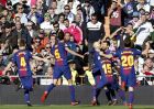 Barcelona's Lionel Messi, 2nd right, celebrates after scoring his side's second goal during the Spanish La Liga soccer match between Real Madrid and Barcelona at the Santiago Bernabeu stadium in Madrid, Spain, Saturday, Dec. 23, 2017. (AP Photo/Francisco Seco)