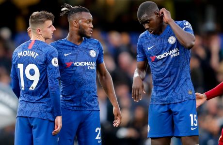 From left, Chelsea's Mason Mount, Michy Batshuayi and Kurt Zouma react at the end of the British Premier League soccer match between Chelsea and Liverpool, at the Stamford Bridge Stadium, London, Sunday, Sept. 22, 2019. Liverpool won 2-1. (AP Photo/Frank Augstein)