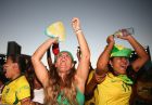 FORTALEZA, BRAZIL - JUNE 12:  Fans cheer after Brazil scored a goal during the FIFA Fan Fest on Fortaleza beach on June 12, 2014 in Fortaleza, Brazil.  (Photo by Robert Cianflone/Getty Images)