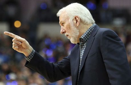 San Antonio Spurs head coach Gregg Popovich gestures to a player in the second half of an NBA basketball game against the Dallas Mavericks, Wednesday, Jan. 16, 2019, in Dallas. (AP Photo/Richard W. Rodriguez)