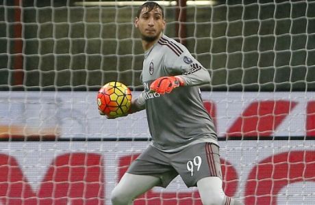 FILE - In this Wednesday, Oct. 28, 2015 file photo, AC Milan goalkeeper Gianluigi Donnarumma gets the ball during the Serie A soccer match between AC Milan and Chievo at the San Siro stadium in Milan, Italy. Defending champions Juventus will play AC Milan for the Italian Super Cup in Doha on Friday, Dec. 23, 2016. (AP Photo/Antonio Calanni, File)
