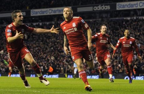 Liverpool's Craig Bellamy celebrates his goal against Manchester City with Jordan Henderson (L) during their English League Cup semi-final soccer match at Anfield in Liverpool, northern England January 25, 2012. REUTERS/Nigel Roddis (BRITAIN - Tags: SPORT SOCCER CARLING CUP) FOR EDITORIAL USE ONLY. NOT FOR SALE FOR MARKETING OR ADVERTISING CAMPAIGNS. NO USE WITH UNAUTHORIZED AUDIO, VIDEO, DATA, FIXTURE LISTS, CLUB/LEAGUE LOGOS OR "LIVE" SERVICES. ONLINE IN-MATCH USE LIMITED TO 45 IMAGES, NO VIDEO EMULATION. NO USE IN BETTING, GAMES OR SINGLE CLUB/LEAGUE/PLAYER PUBLICATIONS