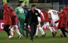 AC Milan coach Gennaro Gattuso walks off the pitch as players celebrate their 2-0 win at the end of a Serie A soccer match between Roma and AC Milan, at the Rome Olympic stadium, Sunday, Feb. 25, 2018. (AP Photo/Alessandra Tarantino)