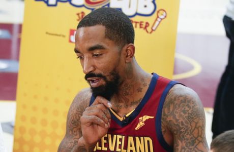 Cleveland Cavaliers' J.R. Smith (5) answers questions for the Kids Club junior reporters during the NBA basketball team's media day, Monday, Sept. 24, 2018, in Independence, Ohio. (AP Photo/Ron Schwane)