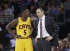 Cleveland Cavaliers head coach David Blatt, right, talks with Will Cherry during an NBA basketball game against the Washington Wizards Wednesday, Nov. 26, 2014, in Cleveland. (AP Photo/Tony Dejak)