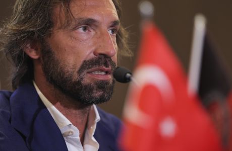 Turkish soccer team Fatih Karagumruk SK's new signing coach Andrea Pirlo talks to journalists in a news conference during an official presentation in Istanbul, Turkey, Monday, June 13, 2022. The former Italian international player has signed a one-year contract with the Istanbul-based team. (AP Photo)