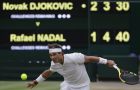 Rafael Nadal of Spain returns the ball to Serbia's Novak Djokovic during their men's singles semifinals match at the Wimbledon Tennis Championships, in London, Saturday July 14, 2018.(AP Photo/Ben Curtis)