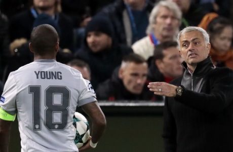 Manchester United coach Jose Mourinho, right, gives instructions to Ashley Young during the Champions League soccer match between CSKA Moscow and Manchester United in Moscow, Russia, Wednesday, Sept. 27, 2017. (AP Photo/Ivan Sekretarev)