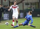 Germany defender Benedikt Howedes, left, is tackled by Italy defender Domenico Criscito during a friendly soccer match at the San Siro stadium in Milan, Italy, Friday, Nov. 15, 2013. (AP Photo/Antonio Calanni)