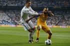 Real Madrid's Cristiano Ronaldo, left, and APOEL Nicosia's Aloneftis battle for the ball during a Champions League group H soccer match between Real Madrid and Apoel Nicosia at the Santiago Bernabeu stadium in Madrid, Spain, Wednesday, Sept. 13, 2017. (AP Photo/Paul White)
