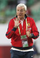 Guangzhou Evergrande's coach Marcello Lippi gestures during the game of the FIFA Club World Cup soccer tournament against Al Ahly, in Agadir, Morocco, Saturday, Dec. 14, 2013. (AP Photo/Christophe Ena)