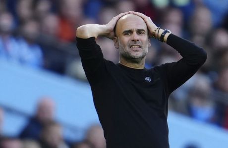 Manchester City's head coach Pep Guardiola reacts during the English Premier League soccer match between Manchester City and Southampton at Etihad stadium in Manchester, England, Saturday, Oct. 8, 2022. (AP Photo/Jon Super)