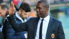 AC Milan coach Clarence Seedorf waves prior to the Serie A soccer match between Udinese and AC Milan at the Friuli Stadium in Udine, Italy, Saturday, March 8, 2014. (AP Photo/Paolo Giovannini)