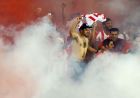 TORONTO, ON - JULY 24: Olympiacos FC fans light flares at the conclusion of the game against of AC Milan during International Champions Cup 2014 action at BMO Field July 24, 2014 in Toronto, Ontario, Canada.   Abelimages/Getty Images/AFP
== FOR NEWSPAPERS, INTERNET, TELCOS & TELEVISION USE ONLY ==
