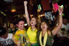 NEW YORK, NY - JUNE 12:  Angela Stewart (R), a Brazilian soccer fan originally from Rio de Janeiro, Brazil, and other Brazilian fans react after a Brazilian goal in the Brazil vs. Croatia World Cup game at Legends Bar on June 12, 2014 in New York City. Brazil vs Croatia is the first game of the World Cup, which will take place throughout Brazil until Sunday, July 13.  (Photo by Andrew Burton/Getty Images)