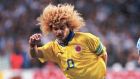 Colombia's midifleder Carlos Valderrama, left, fight for the ball with Argentina's defender Leonardo Astrada, right, Sunday Nov.16,1997, during qualifying soccer game for World Cup France '98 play at Boca Juniors stadium in Buenos Aires.(AP PHOTO/Daniel Muzio)