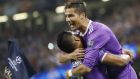 Real Madrid's Cristiano Ronaldo, right, celebrates after scoring the opening goal during the Champions League final soccer match between Juventus and Real Madrid at the Millennium stadium in Cardiff, Wales Saturday June 3, 2017. (AP Photo/Frank Augstein)