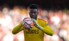 Manchester United's goalkeeper Andre Onana reacts after a penalty awarded to Arsenal is overturned in VAR review during the English Premier League soccer match between Arsenal and Manchester United at Emirates stadium in London, Sunday, Sept. 3, 2023. (AP Photo/Kirsty Wigglesworth)