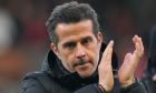 Fulham's head coach Marco Silva gestures just before the start of the English Premier League soccer match between Arsenal and Fulham at Craven Cottage stadium in London, Sunday, Dec. 31, 2023. (AP Photo/Alastair Grant)