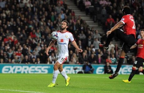 Mandatory Credit: Photo by JMP/REX (4081803t)
Milton Keynes Dons' Will Grigg chests the ball past Manchester United's David De Gea to score his second of the game
MK Dons v Manchester United, Capital One Cup Football, Stadium MK, Britain - 26 August 2014

