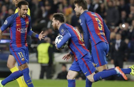 Barcelona's Lionel Messi, center, runs holding the ball after scoring on a penalty, flanked by his teammates Neymar, left and Gerard Pique, during the Champions League round of 16, second leg soccer match between FC Barcelona and Paris Saint Germain at the Camp Nou stadium in Barcelona, Spain, Wednesday March 8, 2017. (AP Photo/Emilio Morenatti)