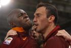 Romas Vasileios Torosidis, right, celebrates with teammates Victor Ibarbo, left, and Miralem Pjanic after scoring during a Serie A soccer match between Roma and Udinese, at Rome's Olympic stadium, Sunday, May 17, 2015. (AP Photo/Riccardo De Luca)