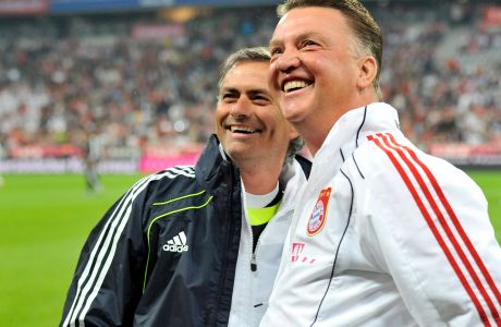 FILE - In this Friday, Aug. 13, 2010 file photo, the then  Bayern Munich head coach Louis van Gaal, right, and the then Real Madrid's head coach Jose Mourinho as they smile prior to the friendly soccer match between FC Bayern Munich and Real Madrid in Munich, southern Germany. Former Manchester United, Barcelona, Bayern and Netherlands coach Louis van Gaal may never return to coaching. The 65-year-old Dutchman has not led a team since being fired by Manchester United in May. (AP Photo/Kerstin Joensson, File)