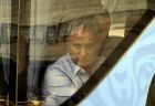 Brazil head coach Tite looks on from inside a bus in his way to the airport in Kazan, Russia, Saturday, July 7, 2018. Brazil lost the quarterfinal against Belgium and leave the soccer World Cup. (AP Photo/Andre Penner)