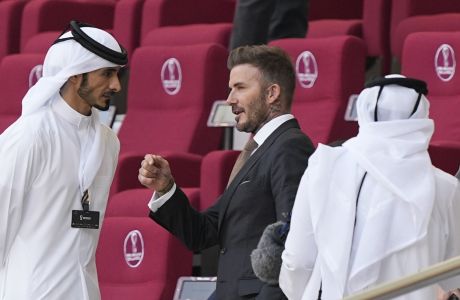 Former England's player and captain , David Beckham, second right, speaks on a tribune before the start of the World Cup group B soccer match between England and Iran at the Khalifa International Stadium, in Doha, Qatar, Monday, Nov. 21, 2022. (AP Photo/Martin Meissner)
