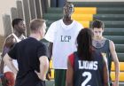 Tacko Fall is a 7' 4" tall basketball player at Liberty Christian Prep in Tavares. He towers over his teammates during basketball practice at the school on Friday, November 22, 2013. (Stephen M. Dowell/Orlando Sentinel)