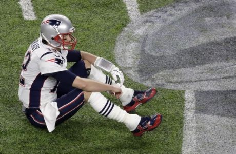 New England Patriots quarterback Tom Brady sits on the field after fumbling against the Philadelphia Eagles during the second half of the NFL Super Bowl 52 football game Sunday, Feb. 4, 2018, in Minneapolis. (AP Photo/Eric Gay)