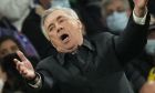 Real Madrid's head coach Carlo Ancelotti gestures during the Champions League, round of 16, second leg soccer match between Real Madrid and Paris Saint-Germain at the Santiago Bernabeu stadium in Madrid, Spain, Wednesday, March 9, 2022. (AP Photo/Manu Fernandez)