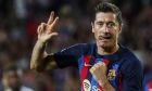 Barcelona's Robert Lewandowski celebrates after scoring his side's fourth goal during a Group C Champions League soccer match between FC Barcelona and Viktoria Plzen at the Camp Nou stadium in Barcelona, Spain, Wednesday, Sept. 7, 2022. (AP Photo/Joan Monfort)