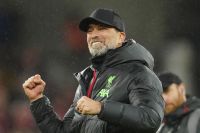 Liverpool's manager Jurgen Klopp celebrates with fans at the end of the English FA Cup fifth round soccer match between Liverpool and Southampton at Anfield stadium, in Liverpool, Wednesday, Feb. 28, 2024. (AP Photo/Jon Super)