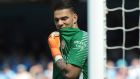 Manchester City goalkeeper Ederson Santana de Moraes holds his shirt during the English Premier League soccer match between Manchester City and Huddersfield Town at Etihad stadium in Manchester, England, Sunday, May 6, 2018. (AP Photo/Rui Vieira)