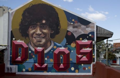 A mural decorates the terrace of soccer legend Diego Armando Maradona's home-turned-museum in Buenos Aires, Argentina, Thursday, Oct. 27, 2016. The home where Maradona lived as a teenager while playing for Argentinos Juniors recently opened to the public, becoming a new shrine for the soccer legend. The mural was painted by artist El Marian. (AP Photo/Natacha Pisarenko)