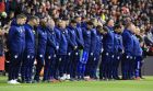 Cardiff City players observe a minute of silence in tribute to Emiliano Sala ahead of the English Premier League soccer match between Southampton and Cardiff City at St Mary's Stadium, Southampton, England, Saturday Feb. 9, 2019. (Mark Kerton/PA via AP)
